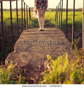 stock-photo-girl-feet-on-vintage-photos-135621614